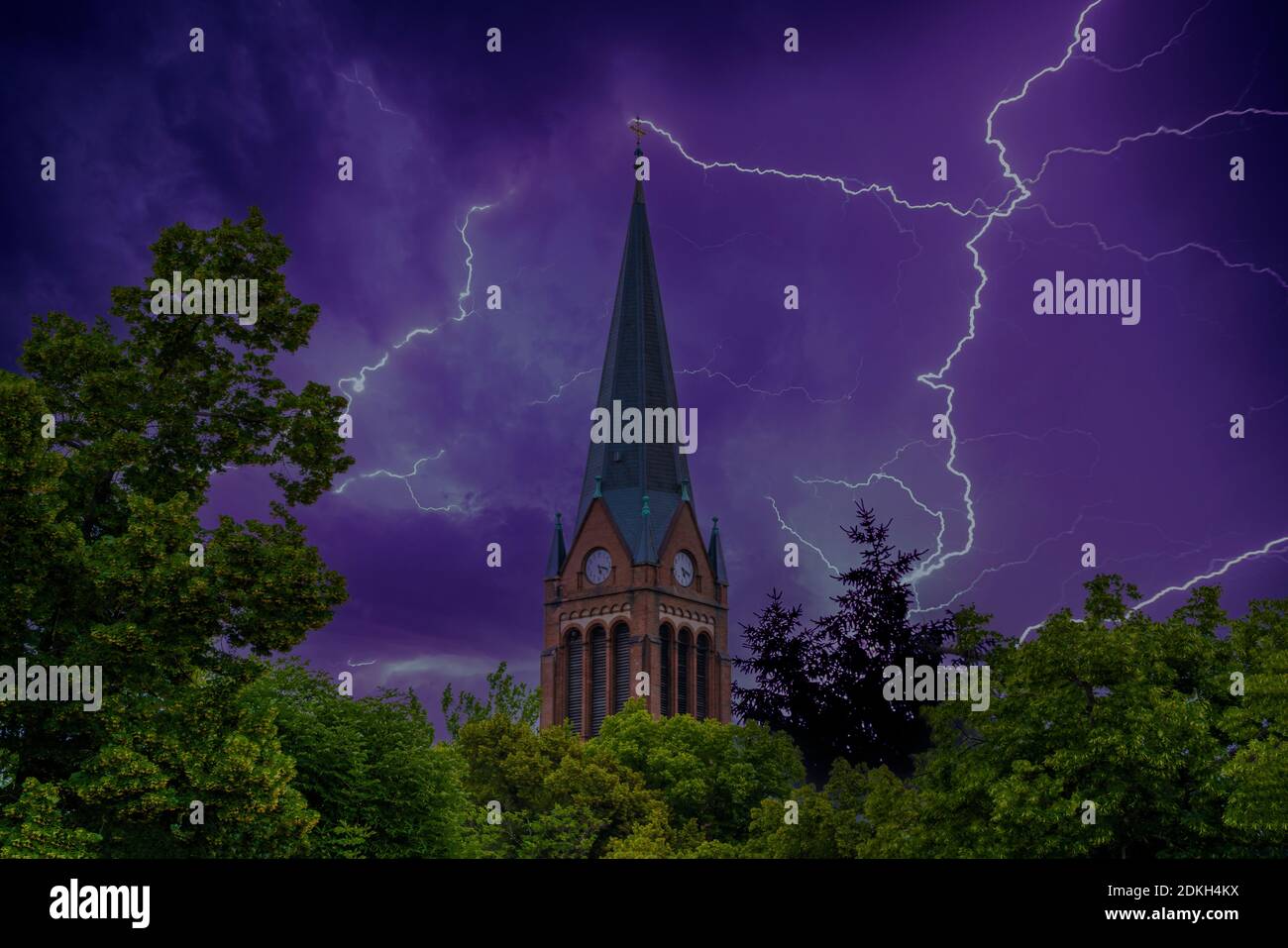 Church tower with lightning from a thunderstorm in the sky (M Stock
