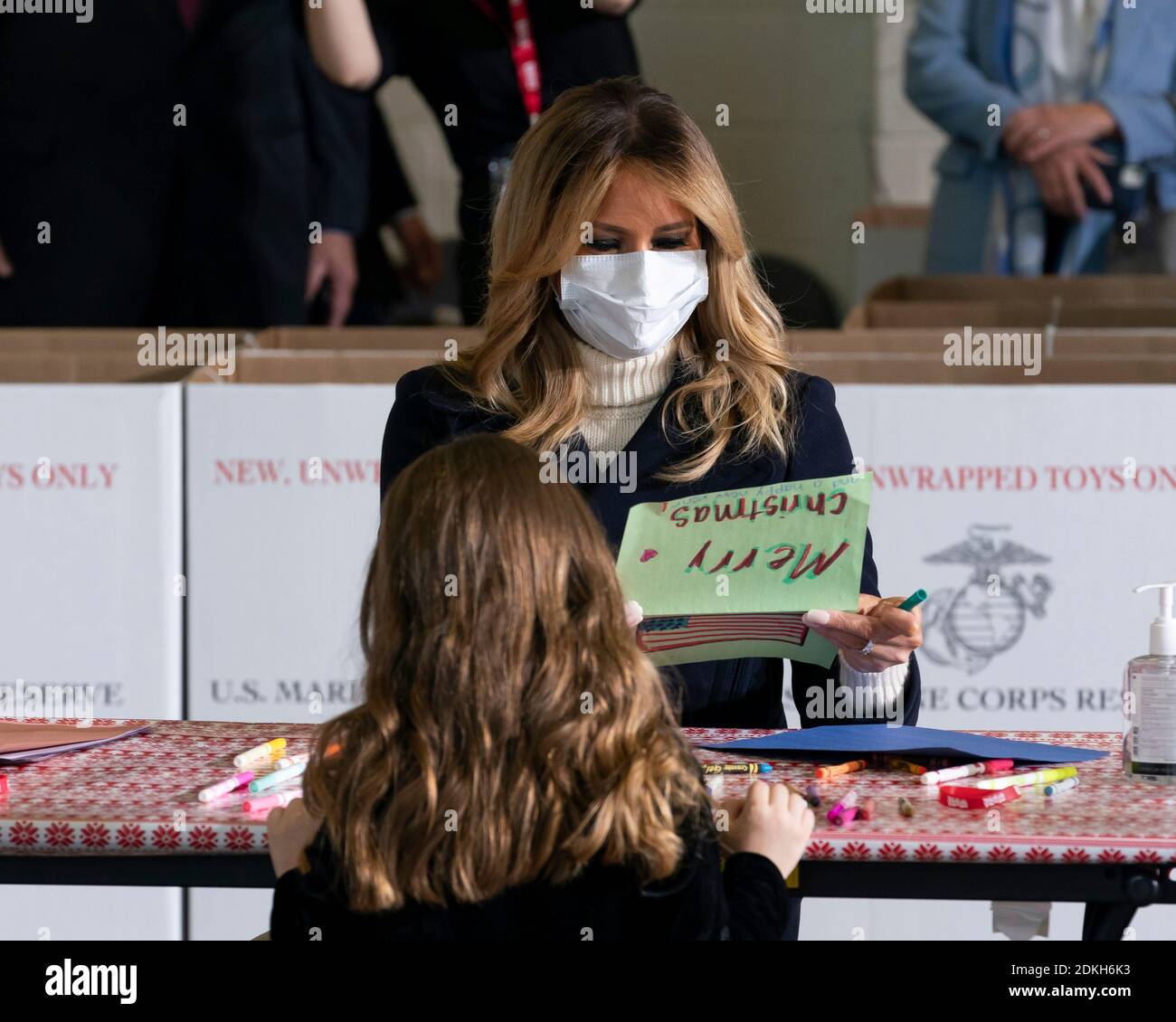 U.S. First Lady Melania Trump works with children to write Christmas cards to the troops during a Toys for Tots Christmas event at Joint Base Anacostia-Bolling December 8, 2020 in Washington, D.C. Stock Photo