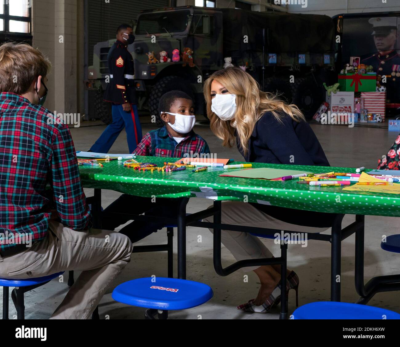 U.S. First Lady Melania Trump works with children to write Christmas cards to the troops during a Toys for Tots Christmas event at Joint Base Anacostia-Bolling December 8, 2020 in Washington, D.C. Stock Photo