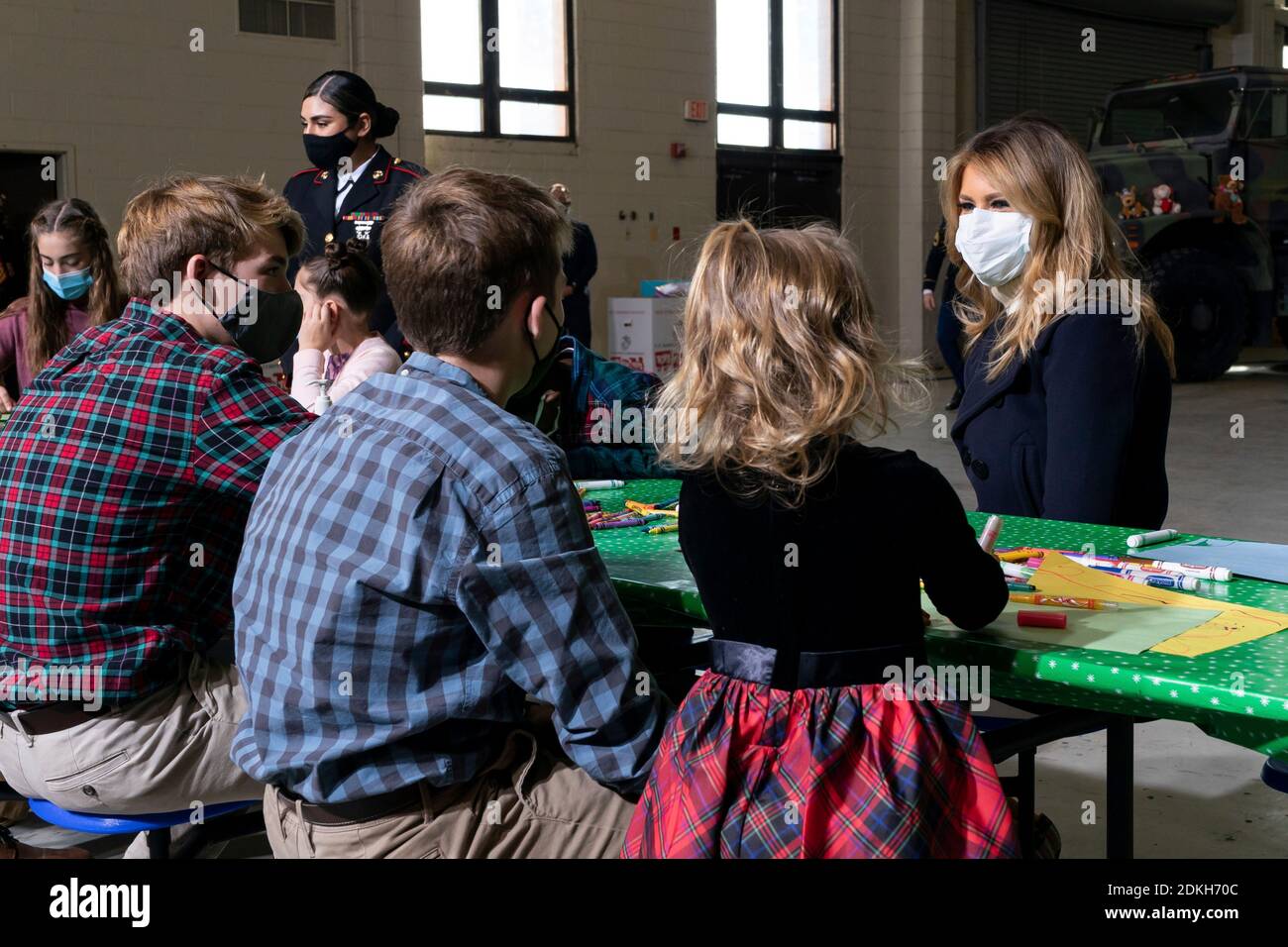 U.S. First Lady Melania Trump works with children to write Christmas cards to the troops during a Toys for Tots Christmas event at Joint Base Anacostia-Bolling December 8, 2020 in Washington, D.C. Stock Photo