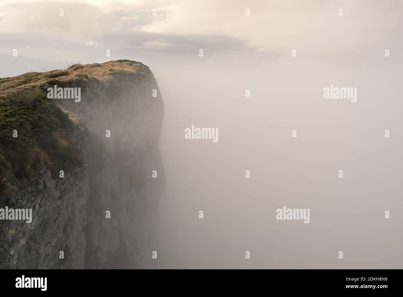 Soft, misty, moody view of fog covered Trem summit, the highest peak of Dry mountain (Suva planina) in Serbia Stock Photo
