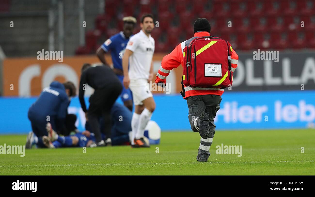 Mark Uth Fc Schalke 04 Is Treated On The Pitch After An Injury An Emergency Doctor Runs To The Pitch Soccer 1st Bundesliga Season 21 11th Matchday Matchday11 Fc Augsburg
