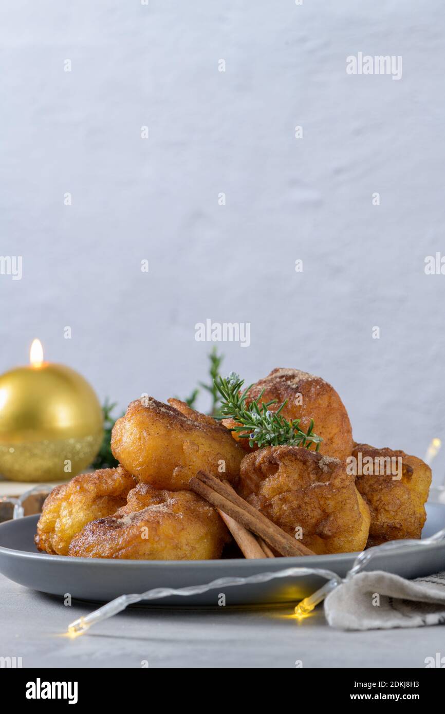 Traditional portuguese Christmas sweets Sonhos with sugar and cinnamon