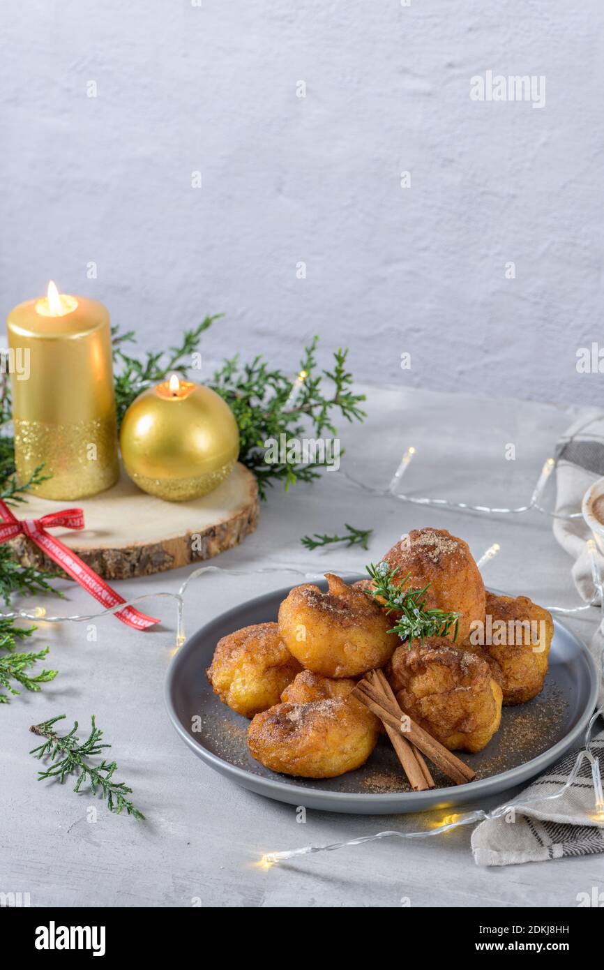 Traditional portuguese Christmas sweets Sonhos with sugar and cinnamon