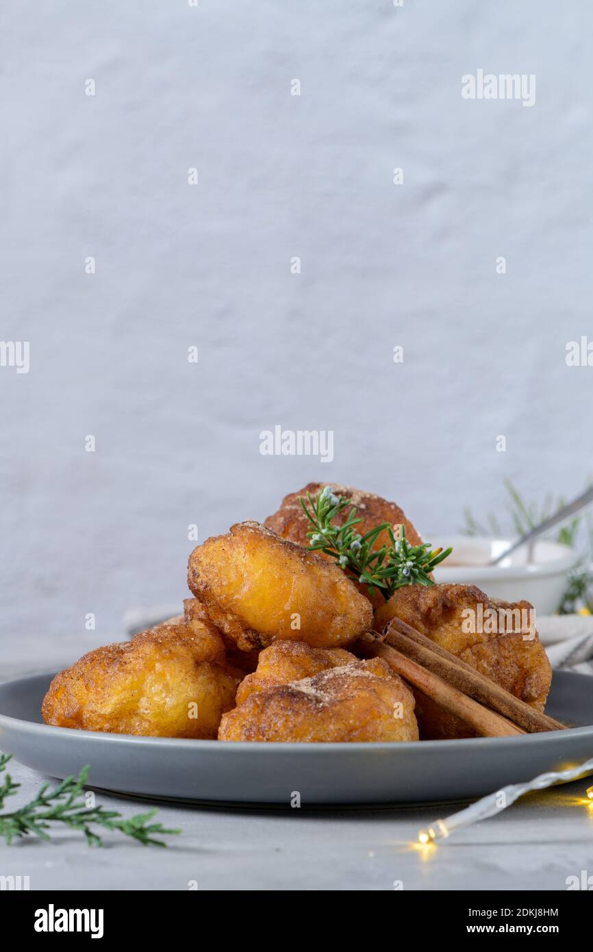 Traditional portuguese Christmas sweets Sonhos with sugar and cinnamon