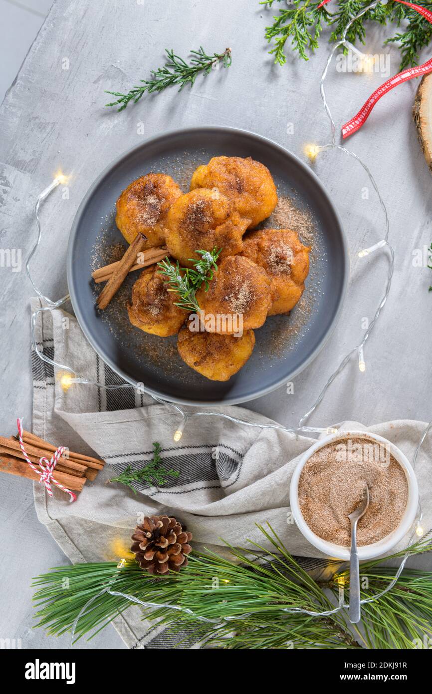 Traditional portuguese Christmas sweets Sonhos with sugar and cinnamon
