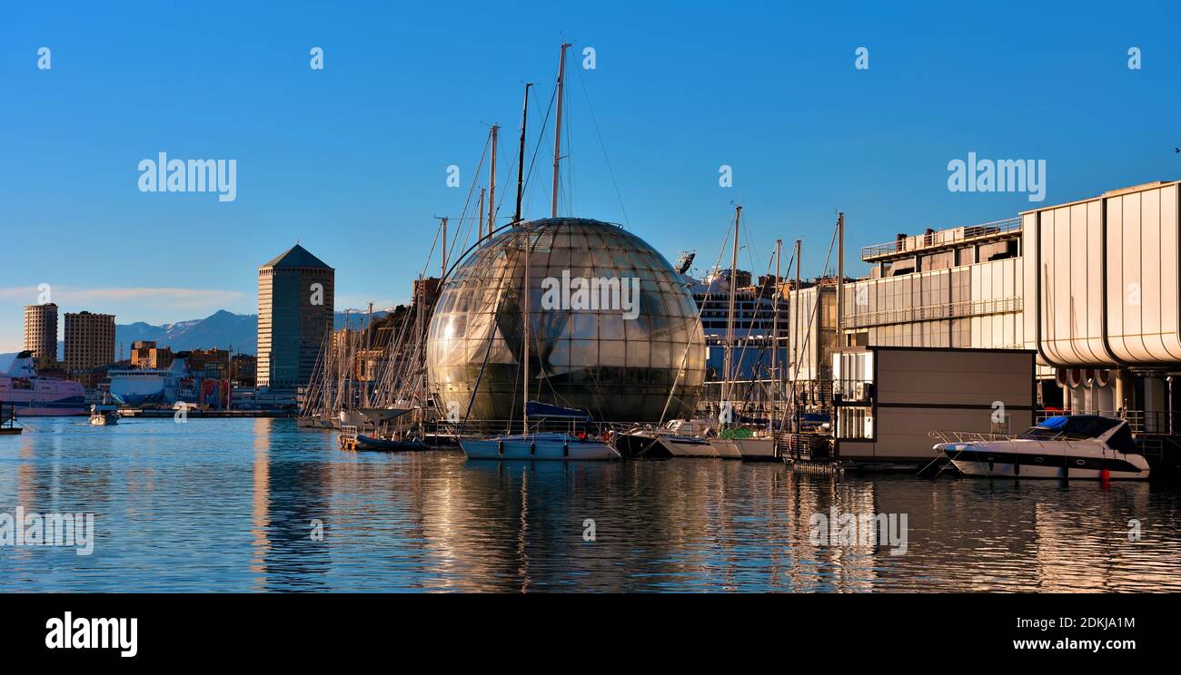 aquarium, bubble (renzo piano biosphere) and panorama of the port and the city skyscrapers December 13 2020 Genoa Italy Stock Photo