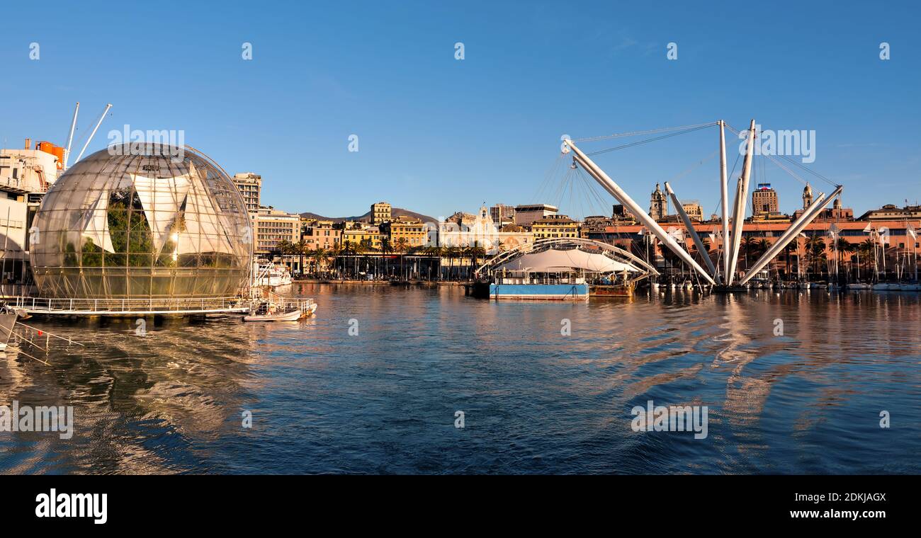 aquarium, bubble (renzo piano biosphere) and panorama of the port and the city skyscrapers December 13 2020 Genoa Italy Stock Photo