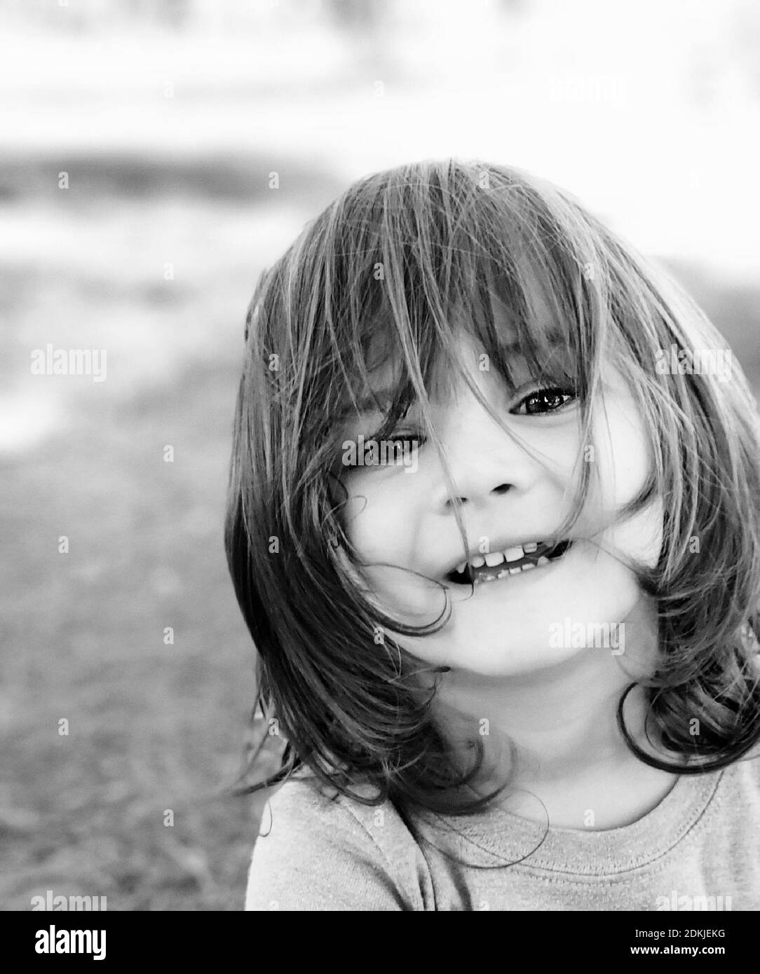 Black And White Portrait Of Cute Long Haired Boy Stock Photo - Alamy