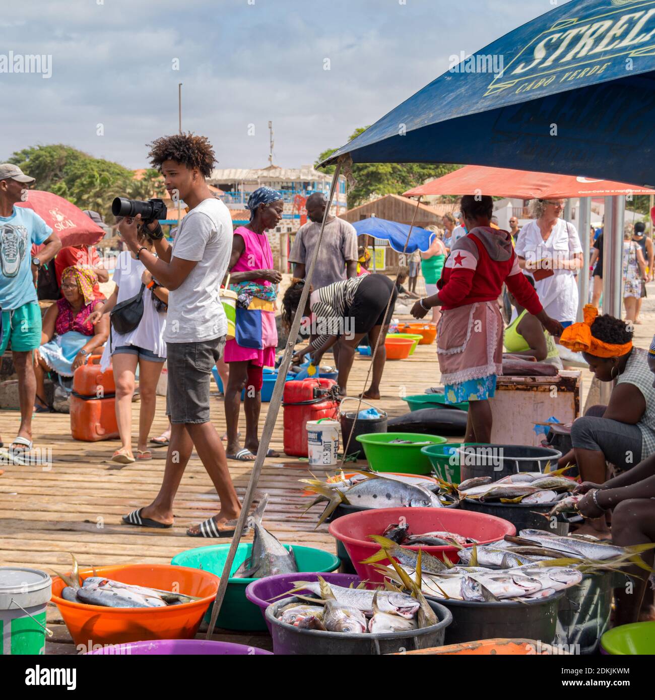 Cabo verde or Cape Verde or Green Cape Santa Maria pontoon wet market from local Fishers with man taking photos Stock Photo