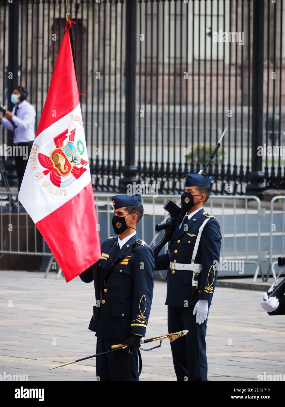 Officers of the Peruvian Air Force, carrying the flag at the ceremony of awarding the Sword of Honour to the officers, recently graduated, who occupied the first position of their class in the training schools of the Armed Forces. Stock Photo