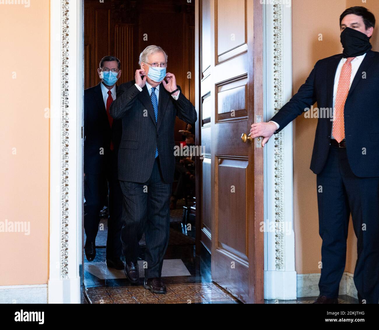 United States:  Senate Majority Leader Mitch McConnell, (R-KY) adjusting his face mask as he is leaving a press conference. Stock Photo