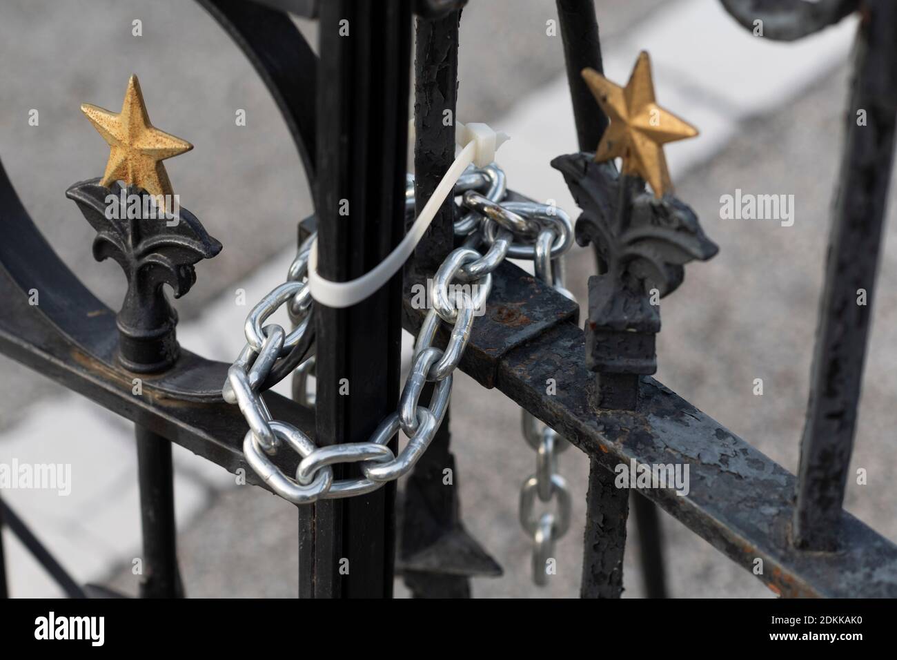 Austin, TX USA December 15, 2020: Locked gates of the Texas Capitol in Austin the evening before Texas Governor Greg Abbott ordered the grounds reopened to the public. The Capitol has been closed for months following vandalism to the grounds and building during protests against police violence after the murder of George Floyd in May, 2020. Credit: Bob Daemmrich/Alamy Live News Stock Photo