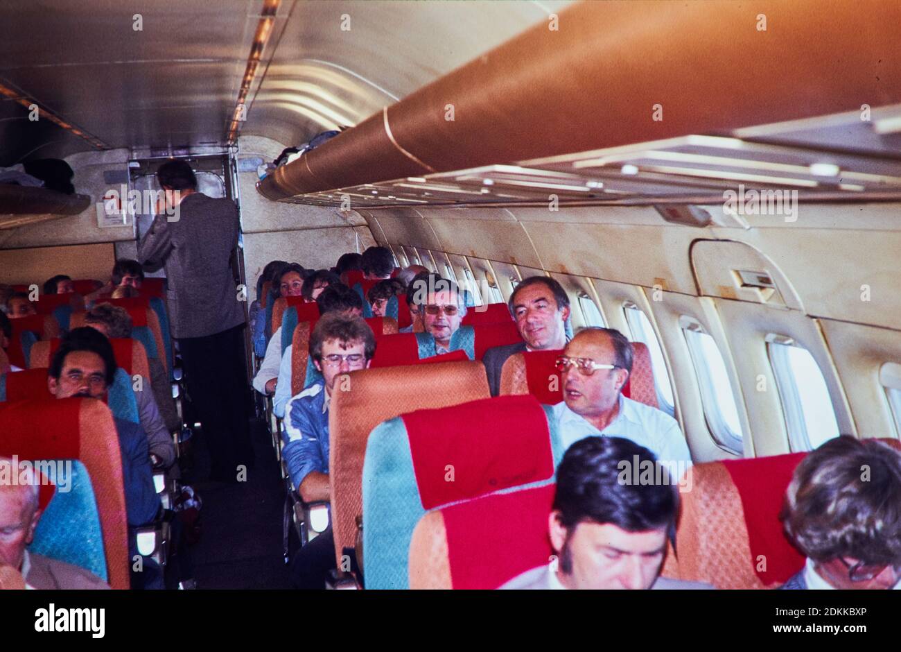 Historical Photo:  Group of business people on board of a McDonnell Douglas DC-9 Tuerk Hava Yollari Turkish Airline THY passenger jet around 1973 in Munich, Riem Airport on the way to Turkey. Reproduction in Marktoberdorf, Germany, October 26, 2020.  © Peter Schatz / Alamy Stock Photos Stock Photo