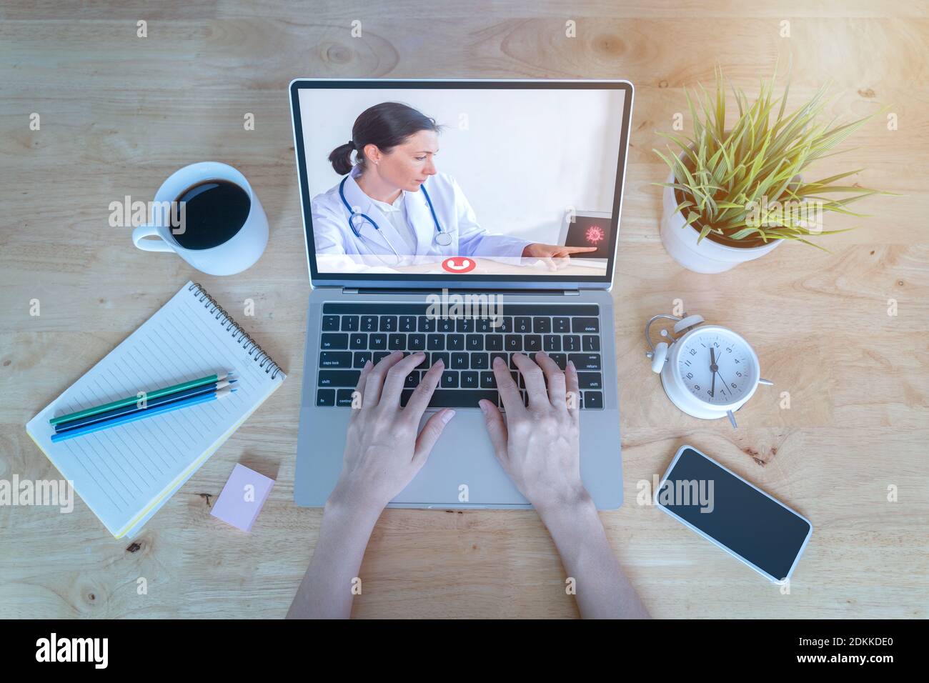 Cropped Hands Of Woman Video Conferencing Over Laptop In Hospital Stock Photo