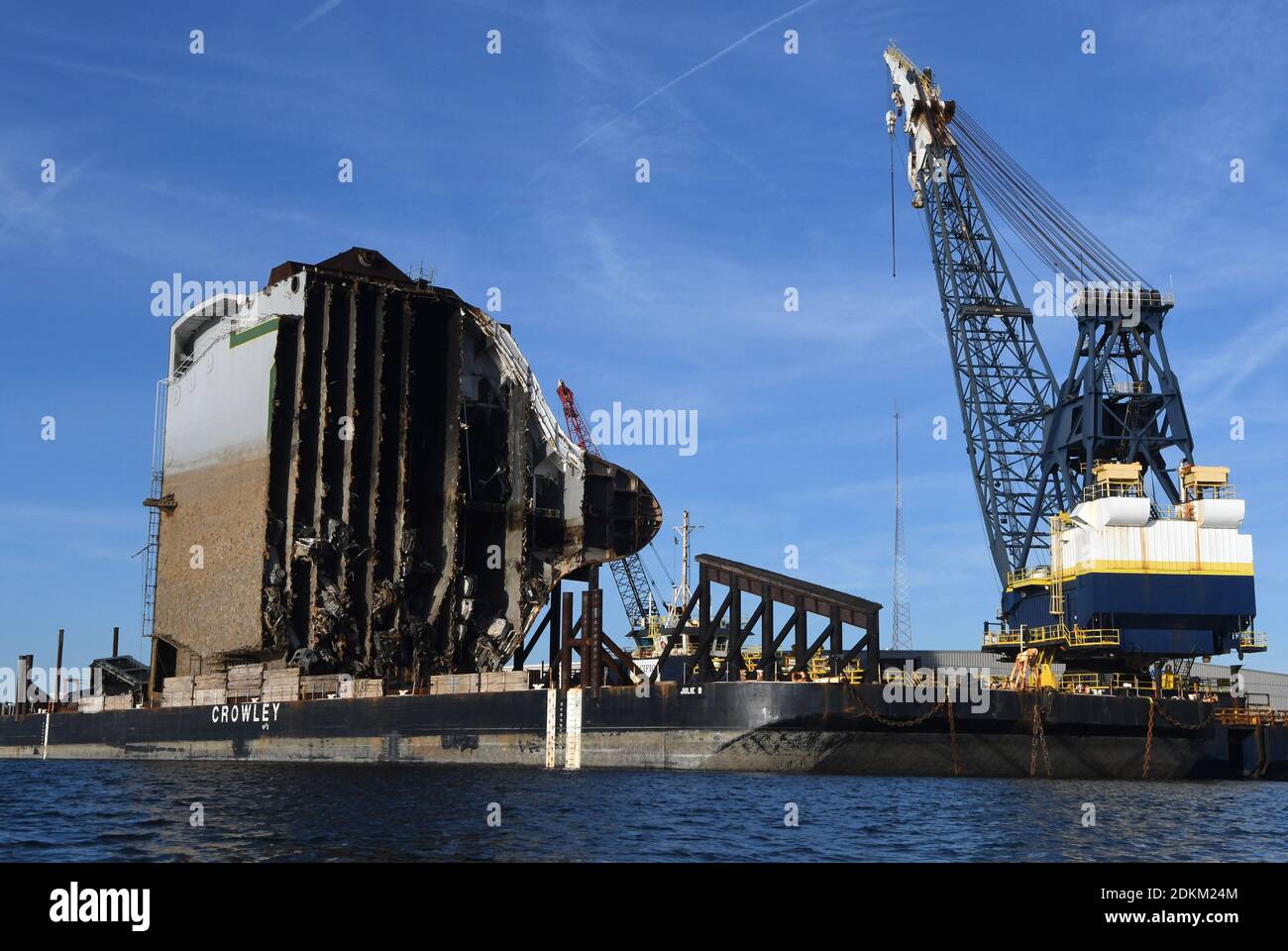 Georgia, USA. 14th Dec, 2020. December 14, 2020 - Brunswick, Georgia, United States - The bow section of the Golden Ray cargo ship sits on a barge on December 14, 2020 in Brunswick, Georgia. A salvage company is cutting the vessel into eight segments, each of which will be removed by a barge. The vehicle carrier, loaded with 4200 new cars, capsized in St. Simons Island Sound on September 8, 2019 as it was leaving the Port of Brunswick, Georgia. (Paul Hennessy/Alamy) Credit: Paul Hennessy/Alamy Live News Stock Photo