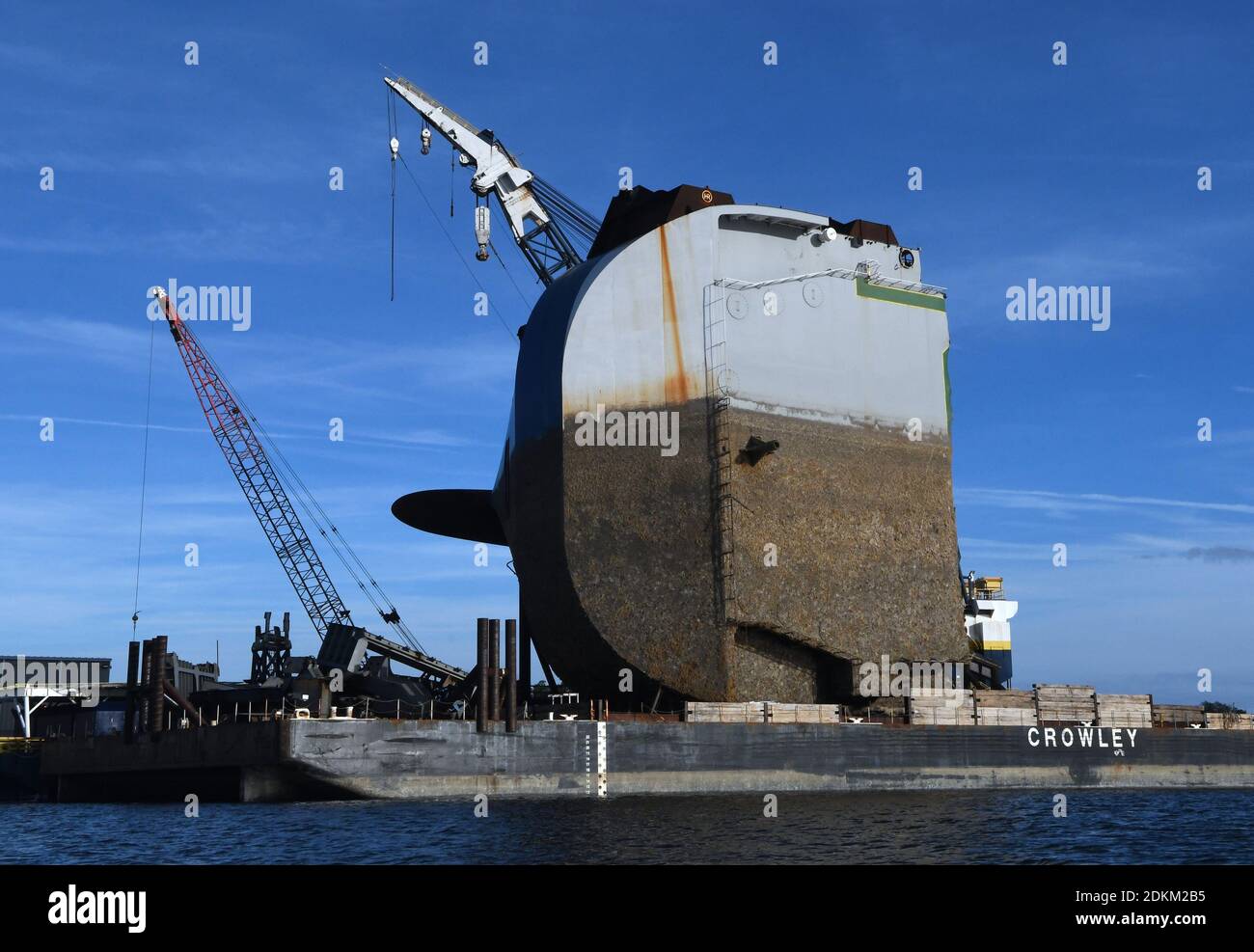Georgia, USA. 14th Dec, 2020. December 14, 2020 - Brunswick, Georgia, United States - The bow section of the Golden Ray cargo ship sits on a barge on December 14, 2020 in Brunswick, Georgia. A salvage company is cutting the vessel into eight segments, each of which will be removed by a barge and scrapped. The vehicle carrier, loaded with 4200 new cars, capsized in St. Simons Island Sound on September 8, 2019 as it was leaving the Port of Brunswick, Georgia. (Paul Hennessy/Alamy) Credit: Paul Hennessy/Alamy Live News Stock Photo