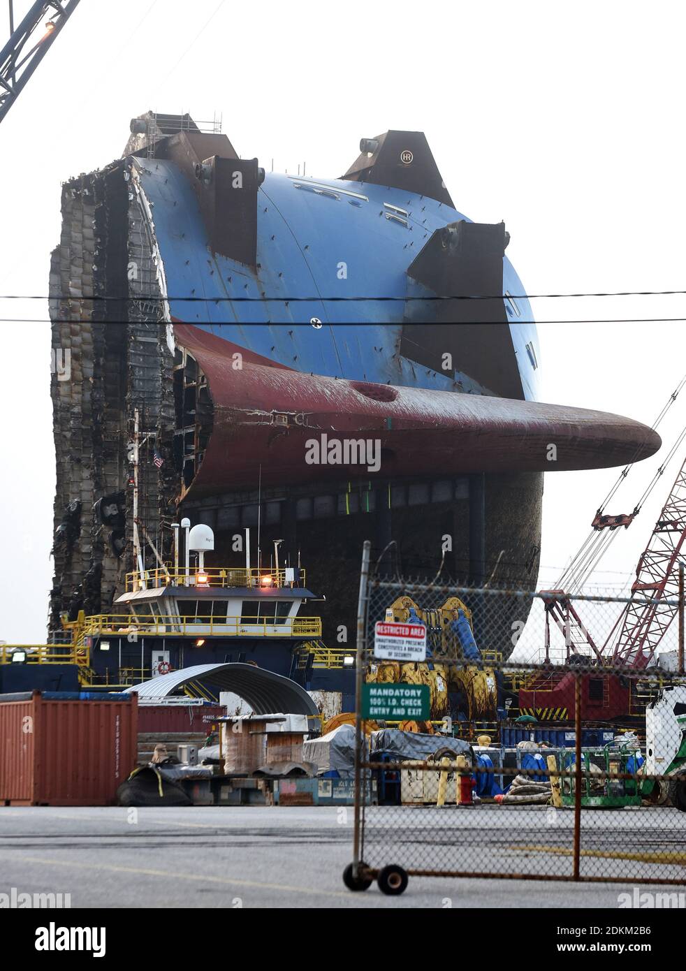 Georgia, USA. 14th Dec, 2020. December 13, 2020 - Brunswick, Georgia, United States - The bow section of the Golden Ray cargo ship sits on a barge on December 13, 2020 in Brunswick, Georgia. A salvage company is cutting the vessel into eight segments, each of which will be removed by a barge and scrapped. The vehicle carrier, loaded with 4200 new cars, capsized in St. Simons Island Sound on September 8, 2019 as it was leaving the Port of Brunswick, Georgia. (Paul Hennessy/Alamy) Credit: Paul Hennessy/Alamy Live News Stock Photo