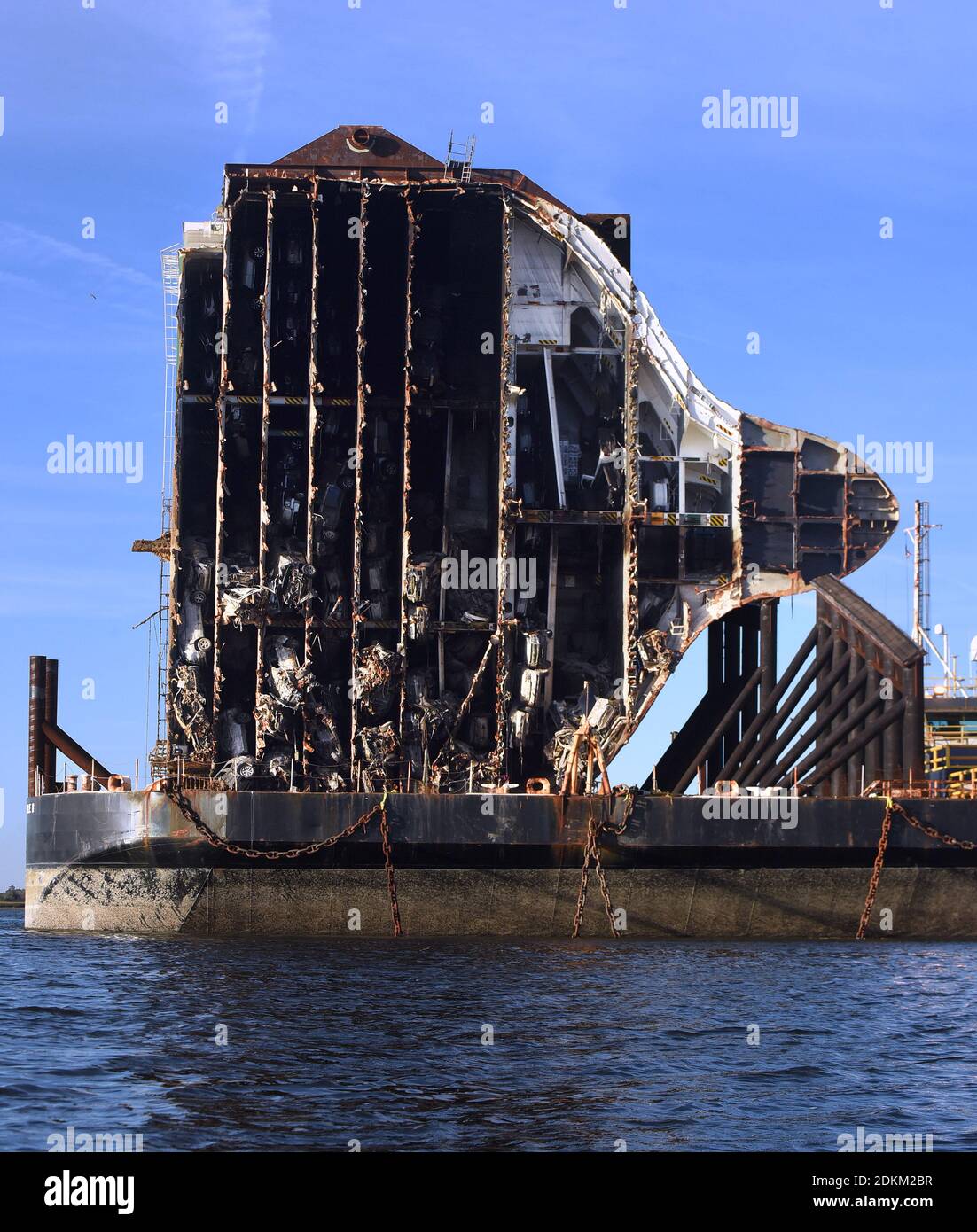 Georgia, USA. 14th Dec, 2020. December 14, 2020 - Brunswick, Georgia, United States - Cars are seen in the bow section of the Golden Ray cargo ship as it sits on a barge on December 14, 2020 in Brunswick, Georgia. A salvage company is cutting the vessel into eight segments, each of which will be removed by a barge and scrapped. The vehicle carrier, loaded with 4200 new cars, capsized in St. Simons Island Sound on September 8, 2019 as it was leaving the Port of Brunswick, Georgia. (Paul Hennessy/Alamy) Credit: Paul Hennessy/Alamy Live News Stock Photo