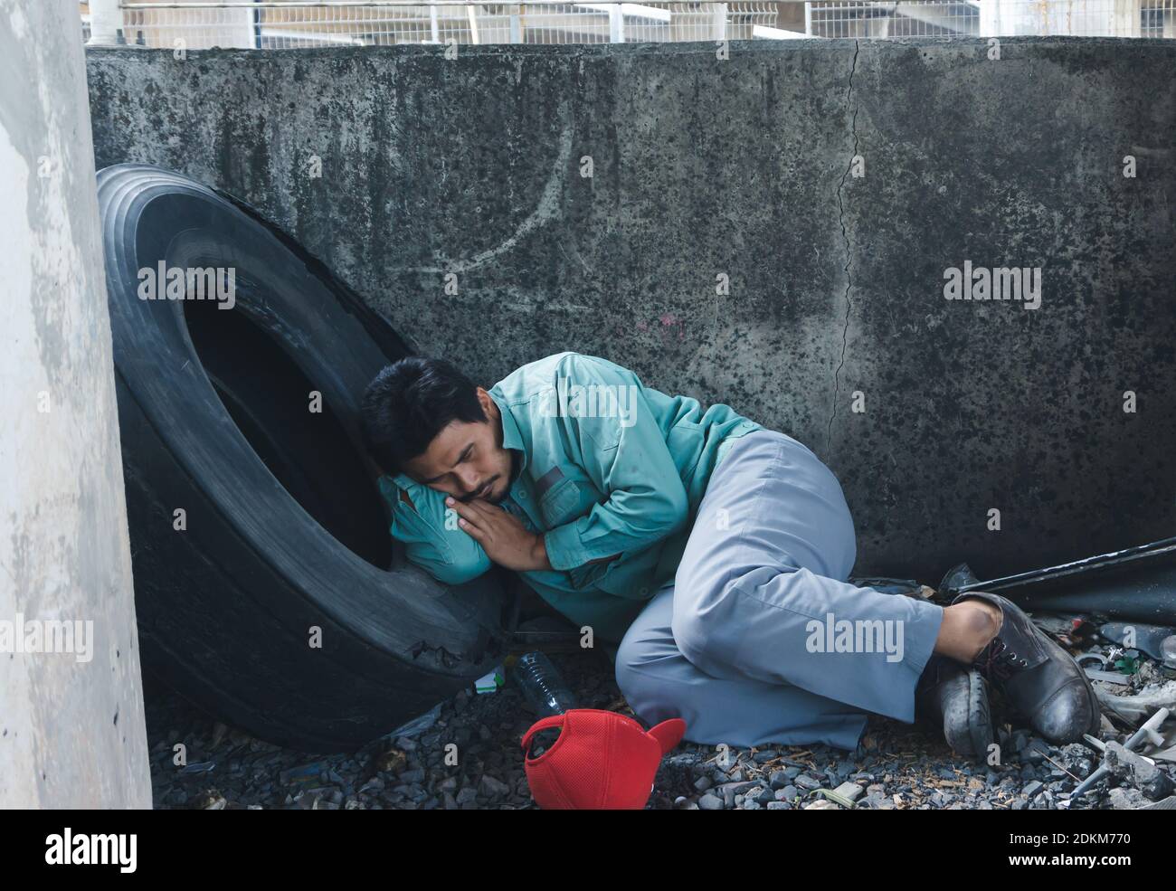 Man Sleeping Against Wall Stock Photo Alamy