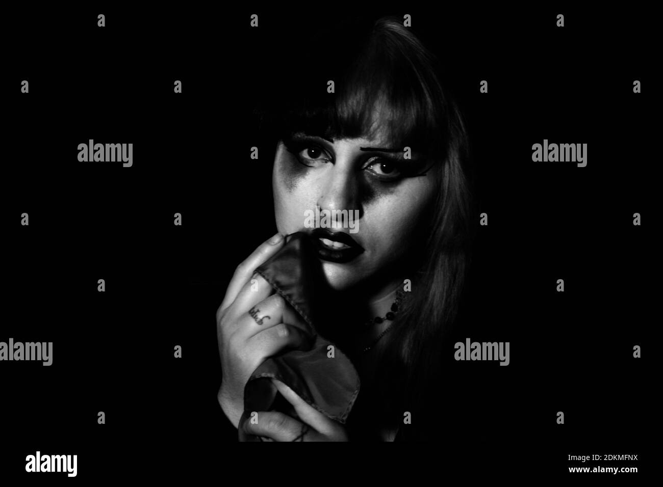 Portrait Of Woman Against Black Background Stock Photo - Alamy