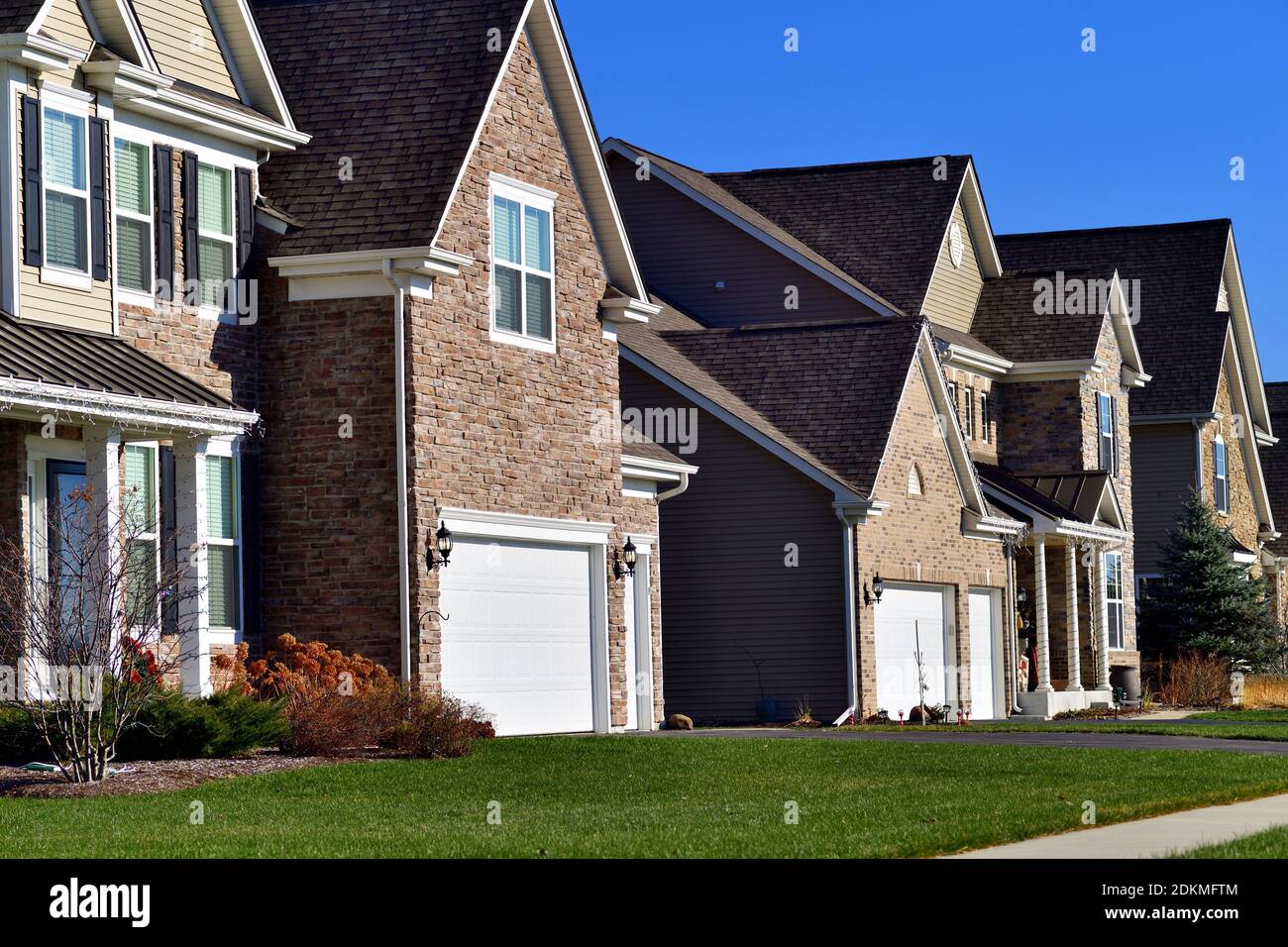 Elburn, Illinois, USA. A series of homes in a modern subdivision provide a variety of facades and elevations in an Illinois community. Stock Photo