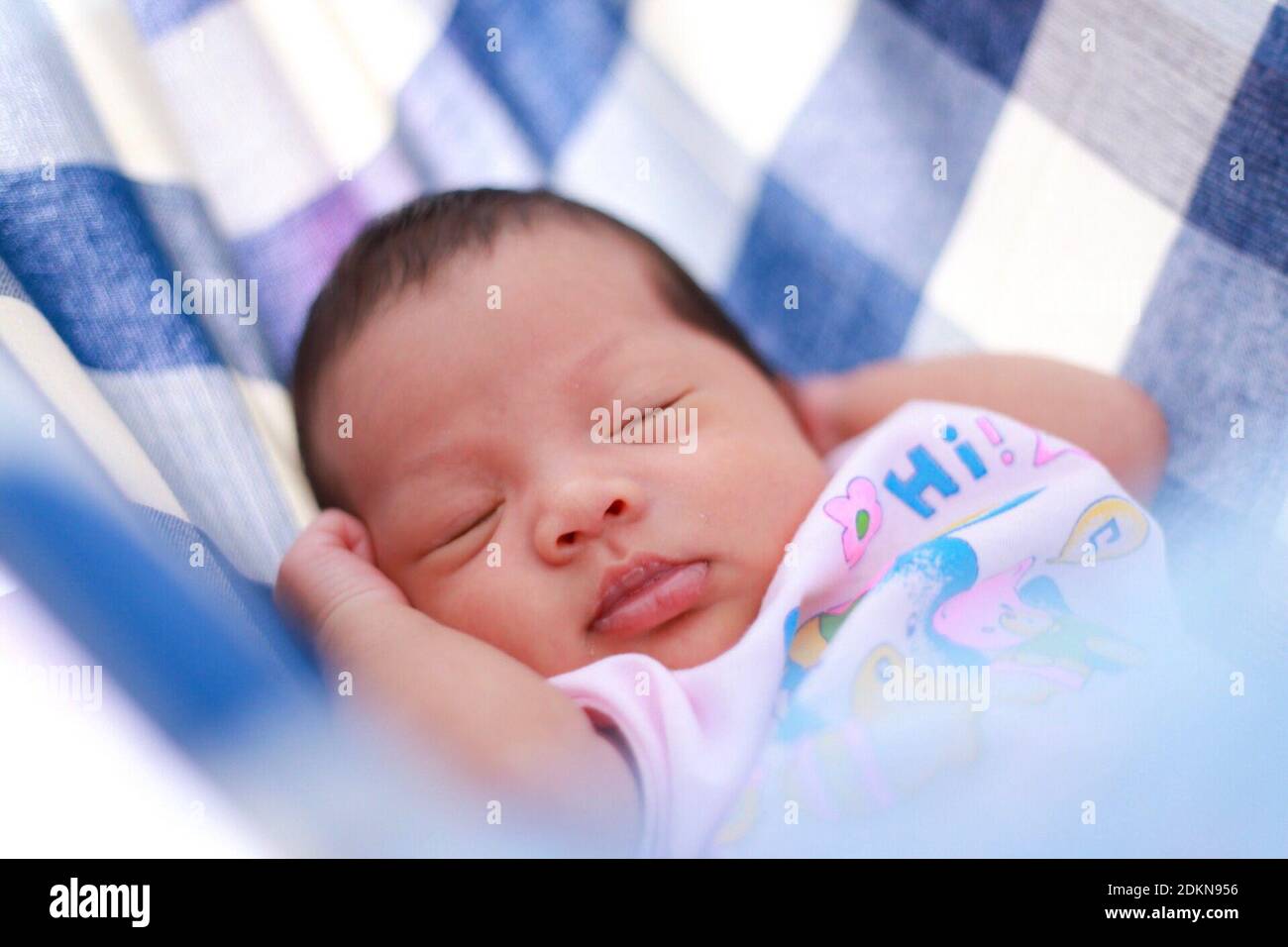 Indian girl sleeping in bed hi-res stock photography and images - Alamy