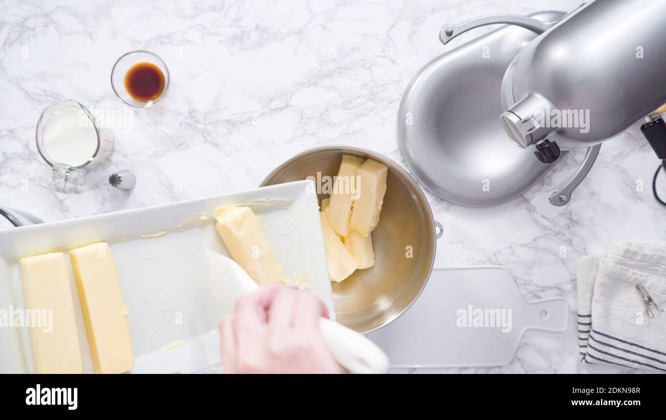 Mixing ingredients in standing kitchen mixer to make buttercream