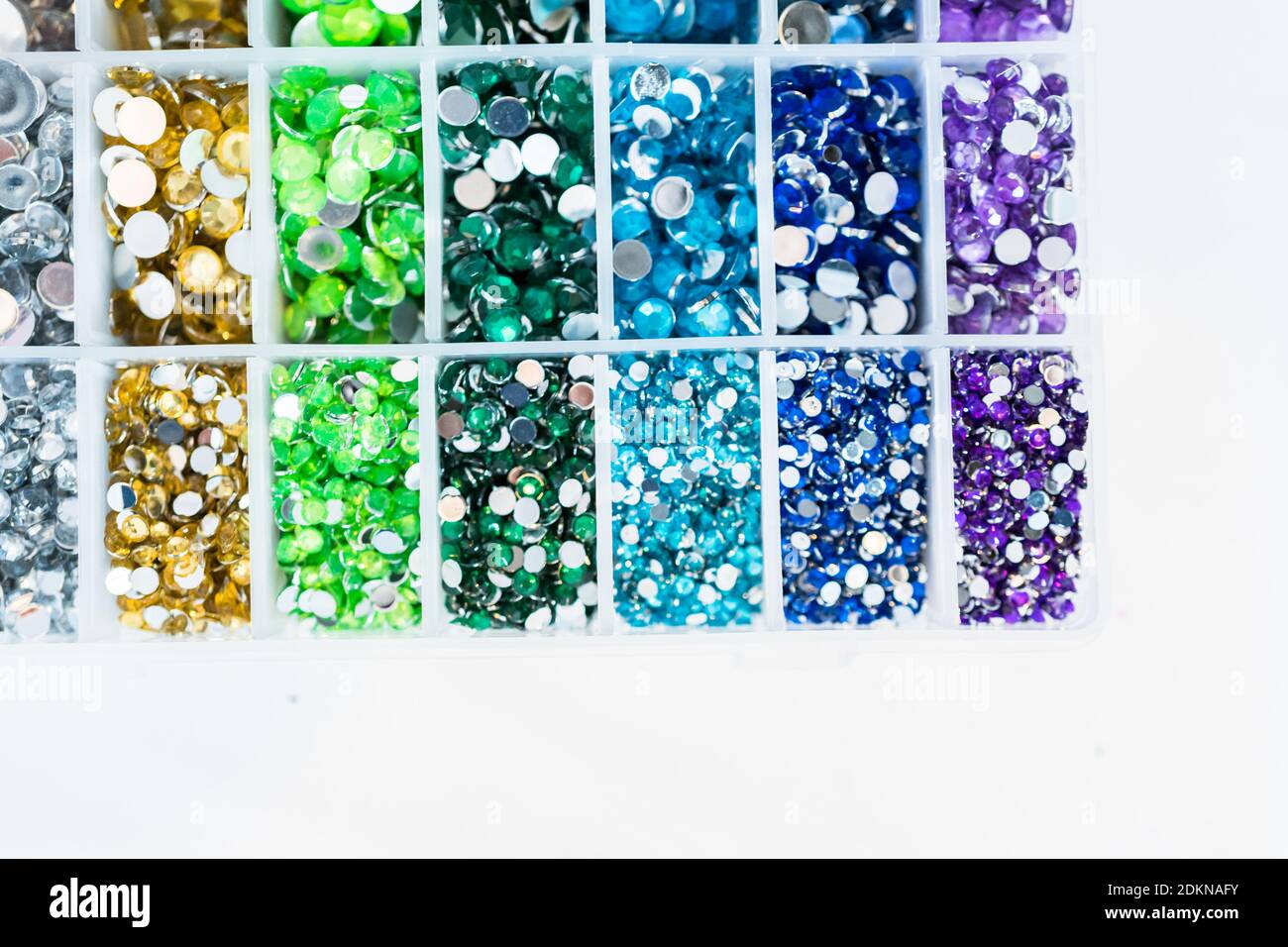 Comparing Craft Rhinestones Color and size variety of rhinestones in the craft box Stock Photo - Alamy