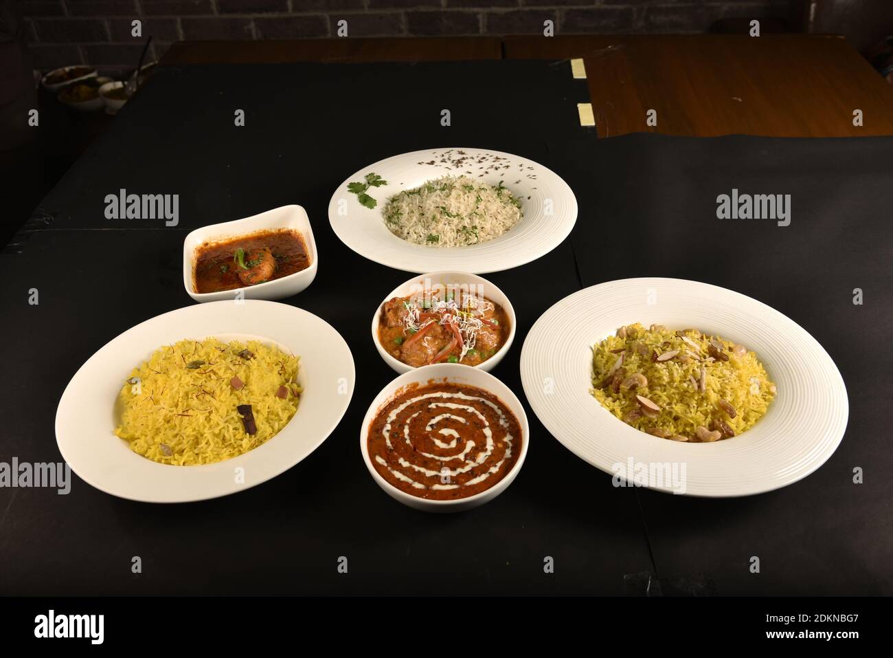 three rice dishes of different flavours served in one table with spicy dal fry,egg curry and paneer Stock Photo