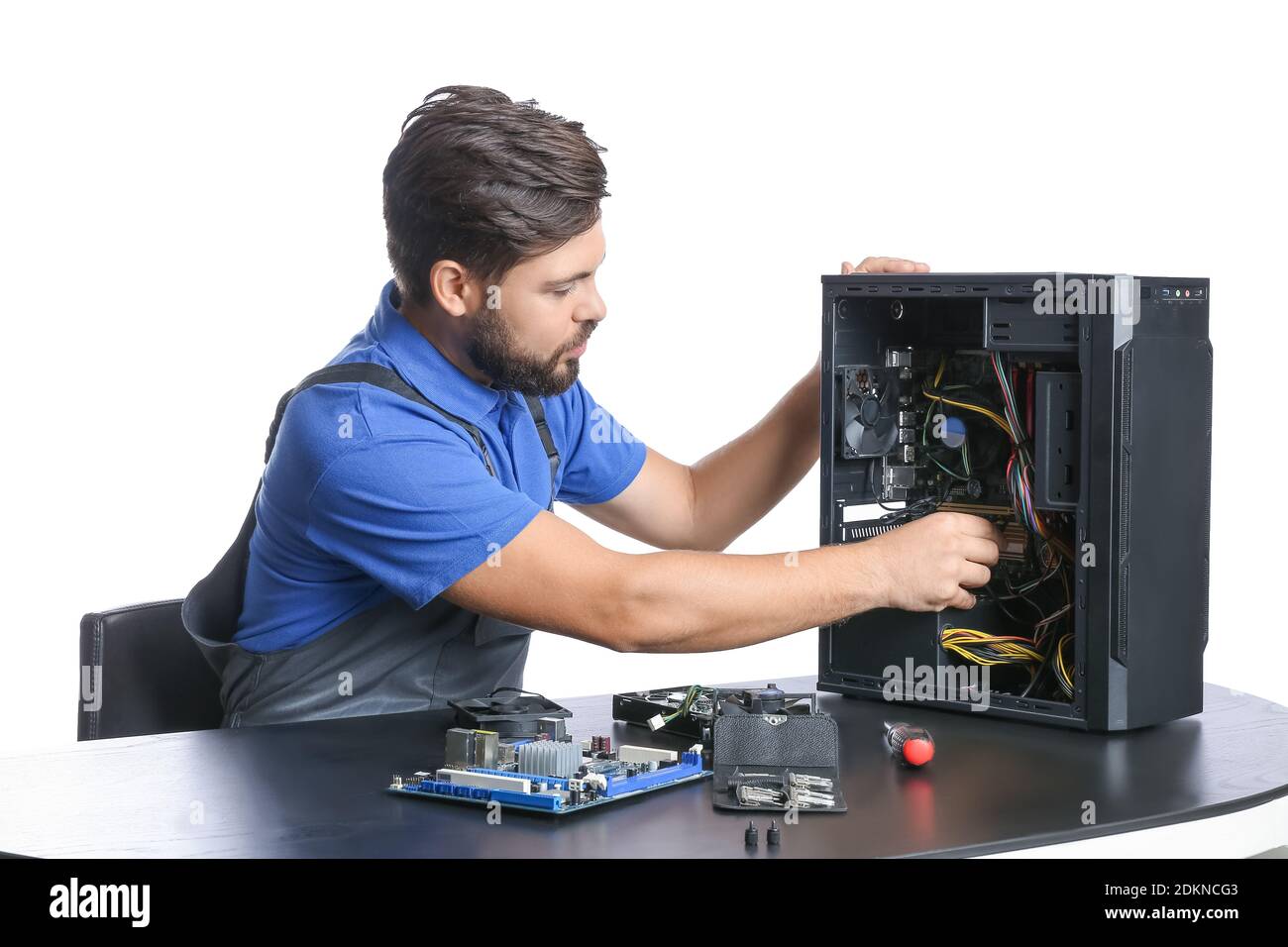 Technician repairing computer on white background Stock Photo - Alamy