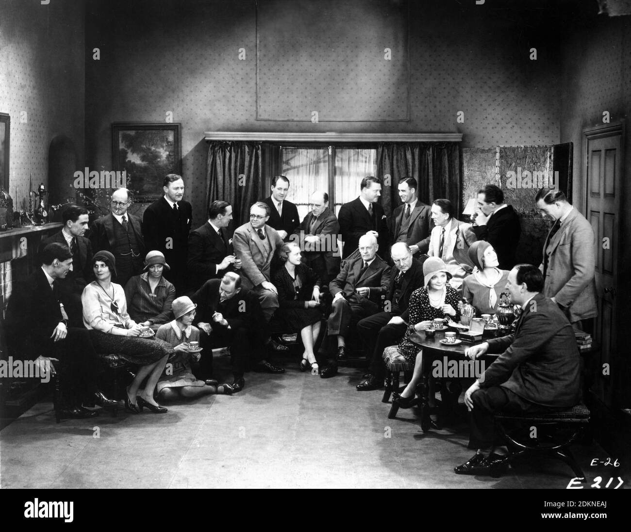 Author JOHN GALSWORTHY (sitting right of centre)visits Cast and Crew including HENRY WILCOXON JEAN CADELL MADELEINE CARROLL BASIL DEAN IAN HUNTER EDNA BEST NIGEL BRUCE AUSTIN TREVOR and GERALD du MAURIER and MABEL POULTON at British Lion Studios Beaconsfield during filming of ESCAPE ! 1930 director BASIL DEAN play John Galsworthy producer Basil Dean Associated Radio Pictures (ARP) / Associated Talking Pictures (ATP) Stock Photo