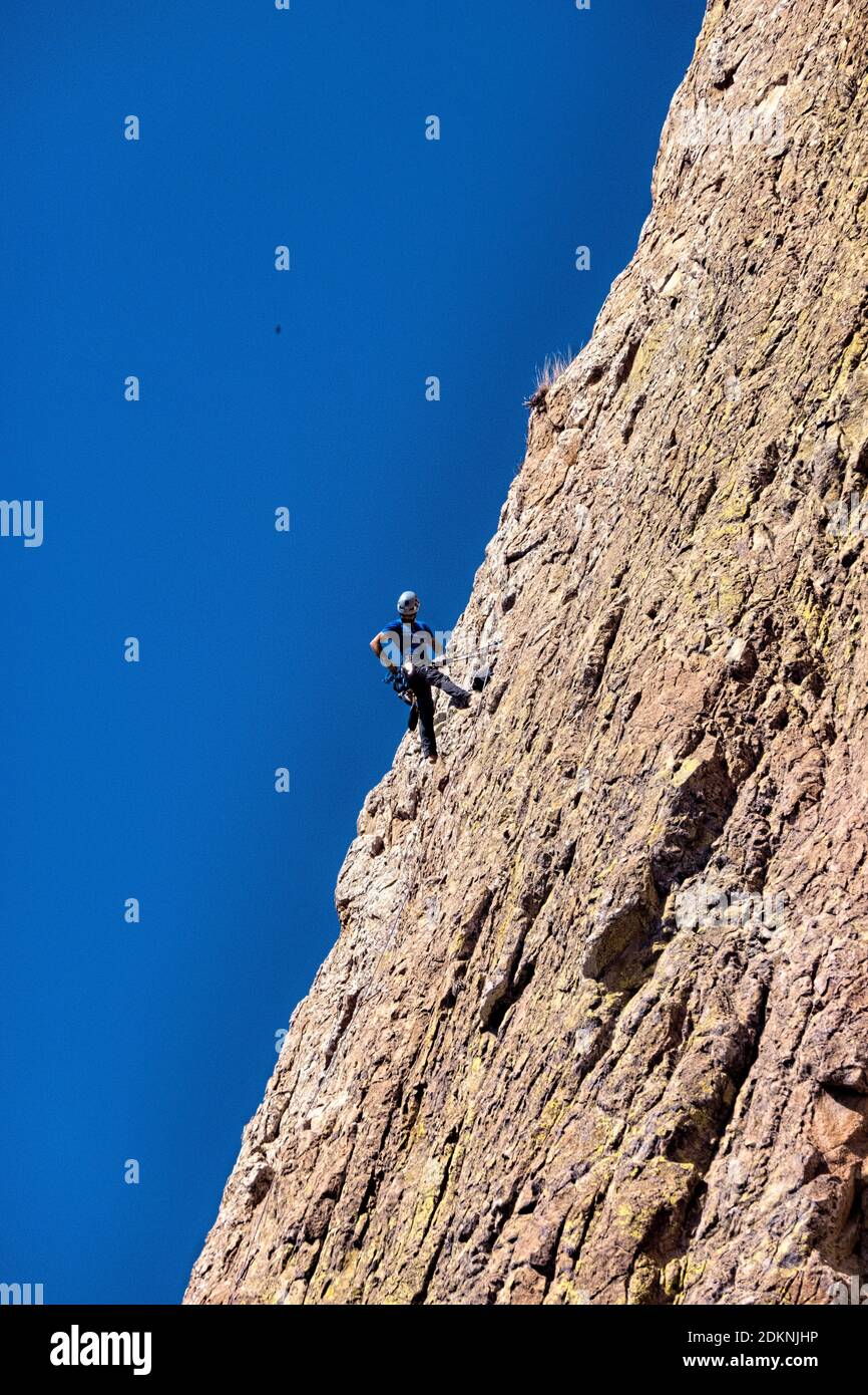 Rock climber on Peña de Bernal, UNESCO site and one of the world’s largest monoliths, Queretaro, Mexico Stock Photo