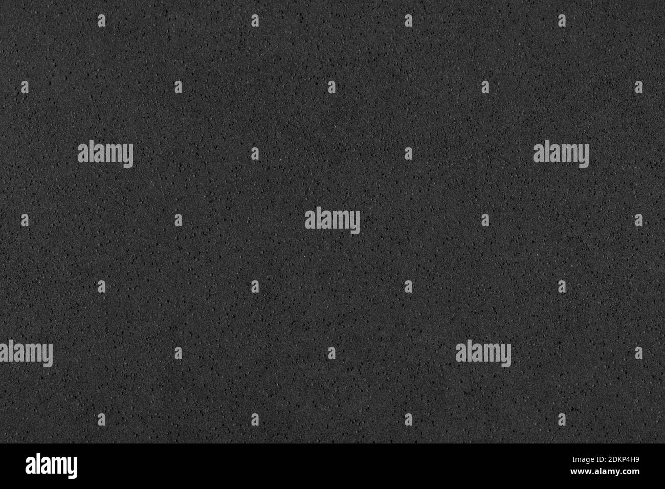 Abstract background - foamed rubber, non-uniform black backdrop for design. Stock Photo