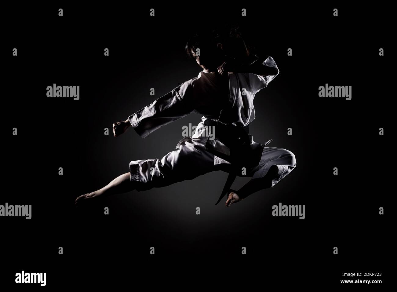Full Length Of Woman Practicing Karate Against Black Background Stock Photo - Alamy Full Length Of Woman Practicing Karate Against Black Background Stock Photo - Alamy