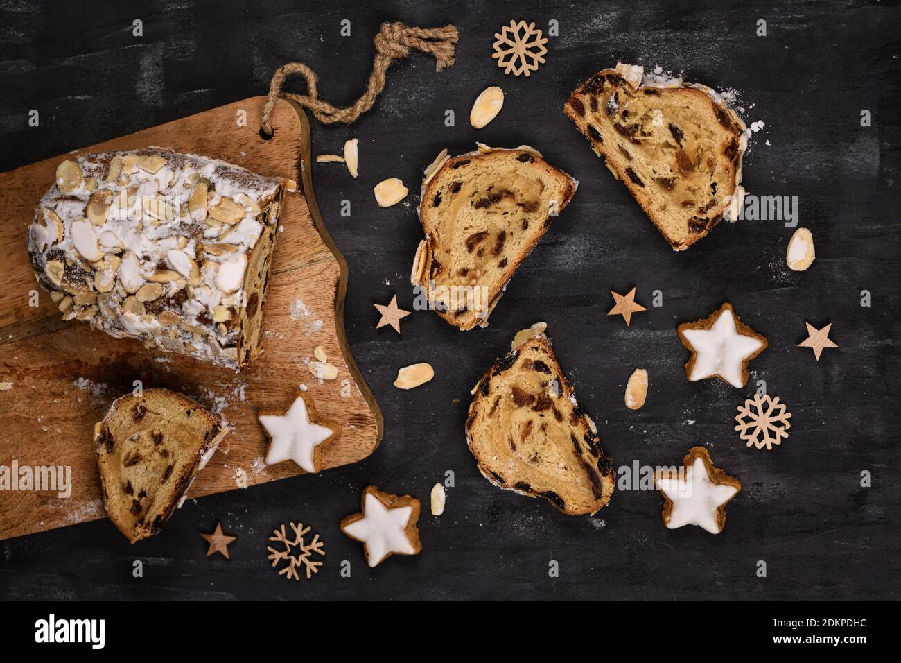 Slice of German Stollen cake, a fruit bread with nuts, spices, and dried fruits with powdered sugar traditionally served during Christmas time Stock Photo