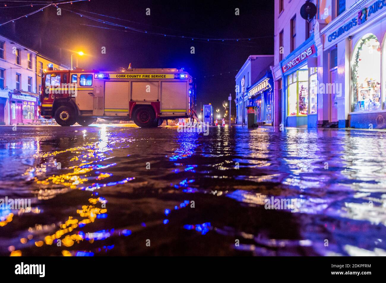 Bantry, West Cork, Ireland. 16th Dec, 2020. Bantry town square flooded this morning before high tide. The County Council and Fire Brigade successfully pumped the flood water away from the businesses and no property damage was caused. Credit: AG News/Alamy Live News Stock Photo