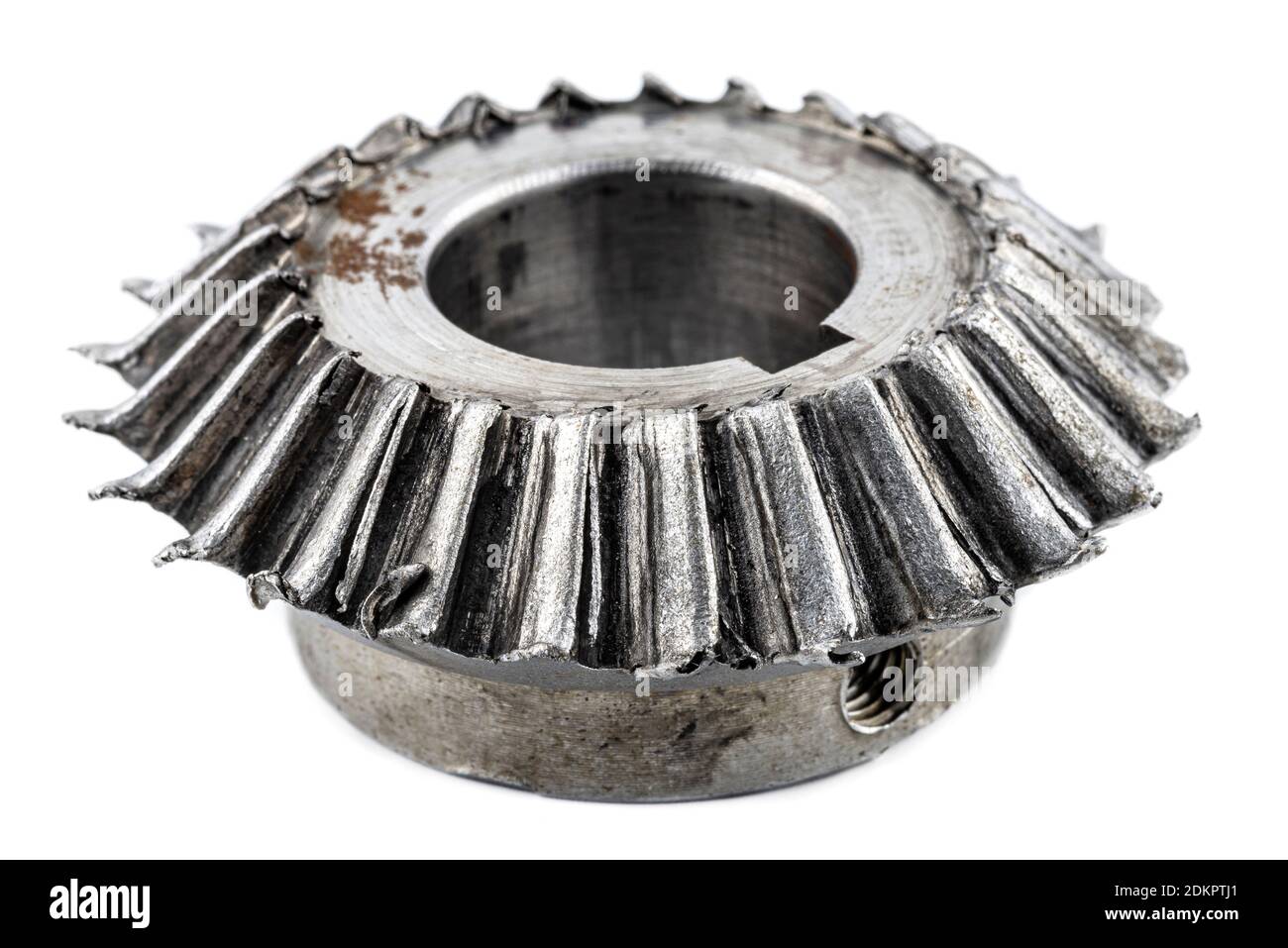 Macro shot of a damaged bevel gear with bevel teeth, isolated on a white background. Stock Photo