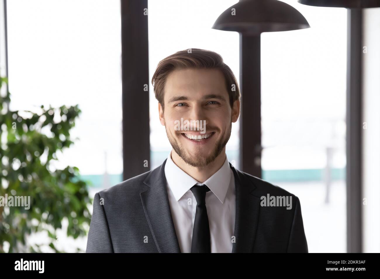 Headshot portrait of smiling Caucasian businessman pose at workplace ...