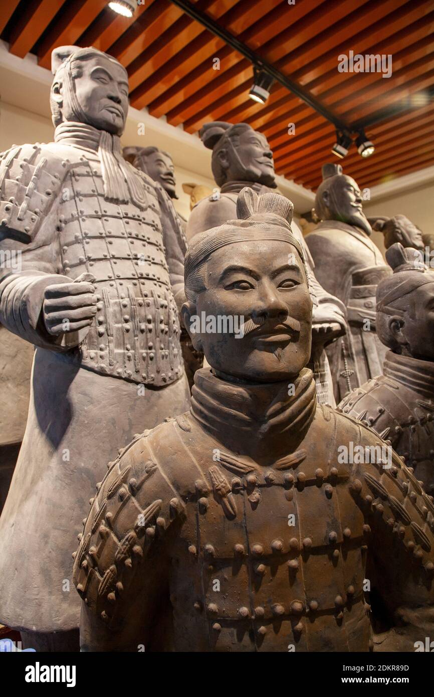 Reproduction souvenir soldiers from the Terracotta Army warrior  sculptures depicting the armies of Qin Shi Huang, the first Emperor of China in Pit 1 Stock Photo