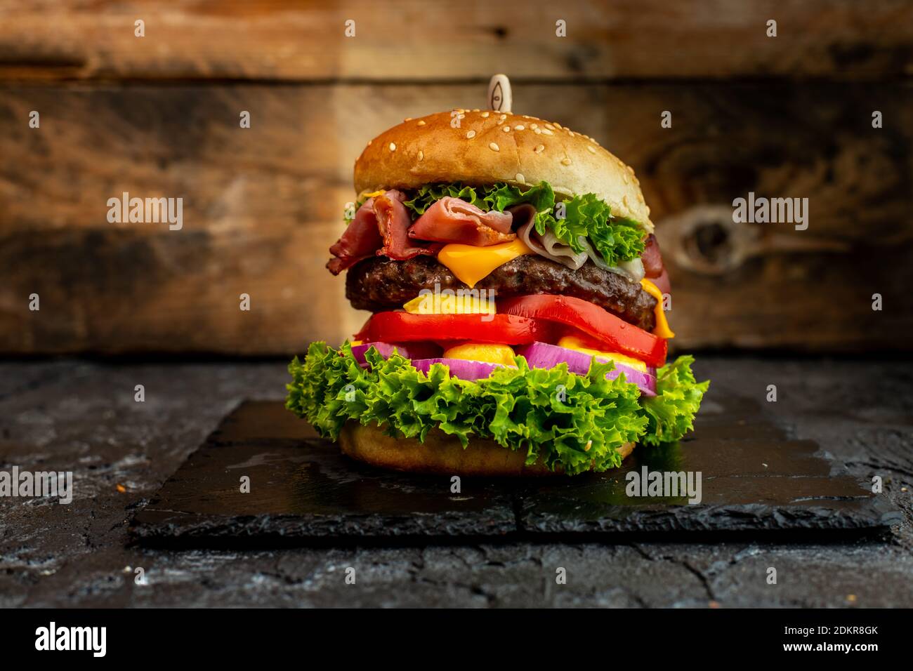Close-up Of Juicy Burger On Rustikal Backgroud Stock Photo