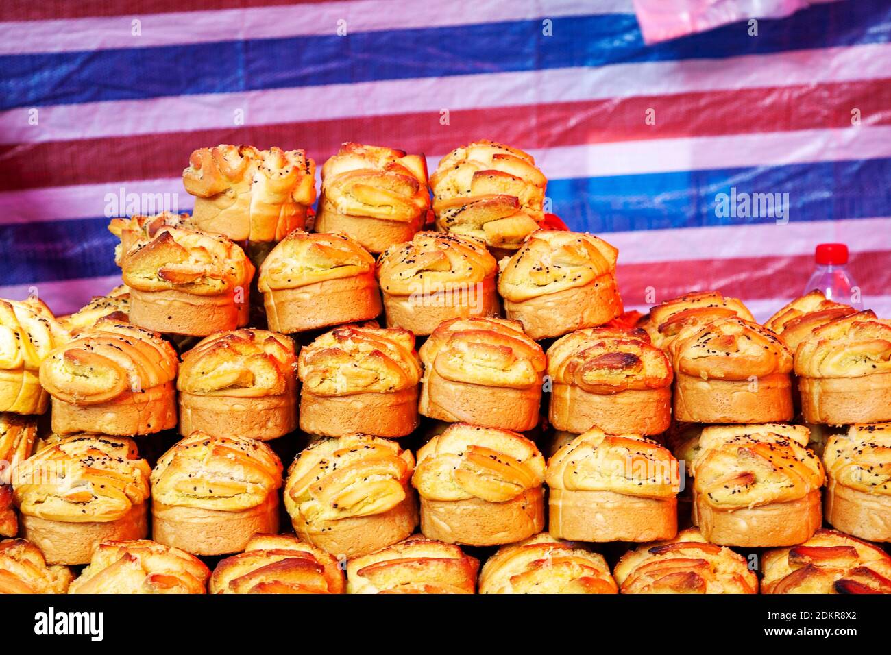 Savory bread treats for sale at street food vendor shop in Muslim Quarter Xian Xi'an China Stock Photo