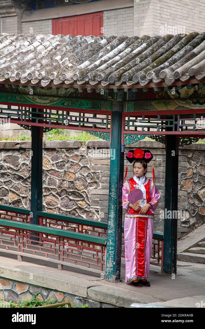 Chinese woman in traditional dress at Summer Palace Beijing Stock Photo