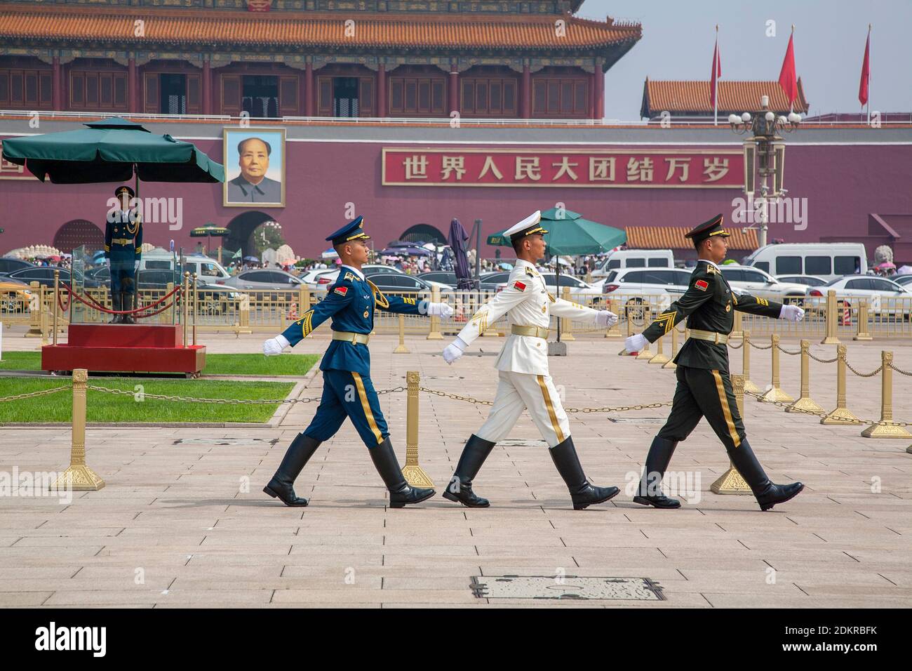 Chinese servicemen march after performing guard duty at flag pole in Tiananmen Square or Tian'anmen Square Stock Photo
