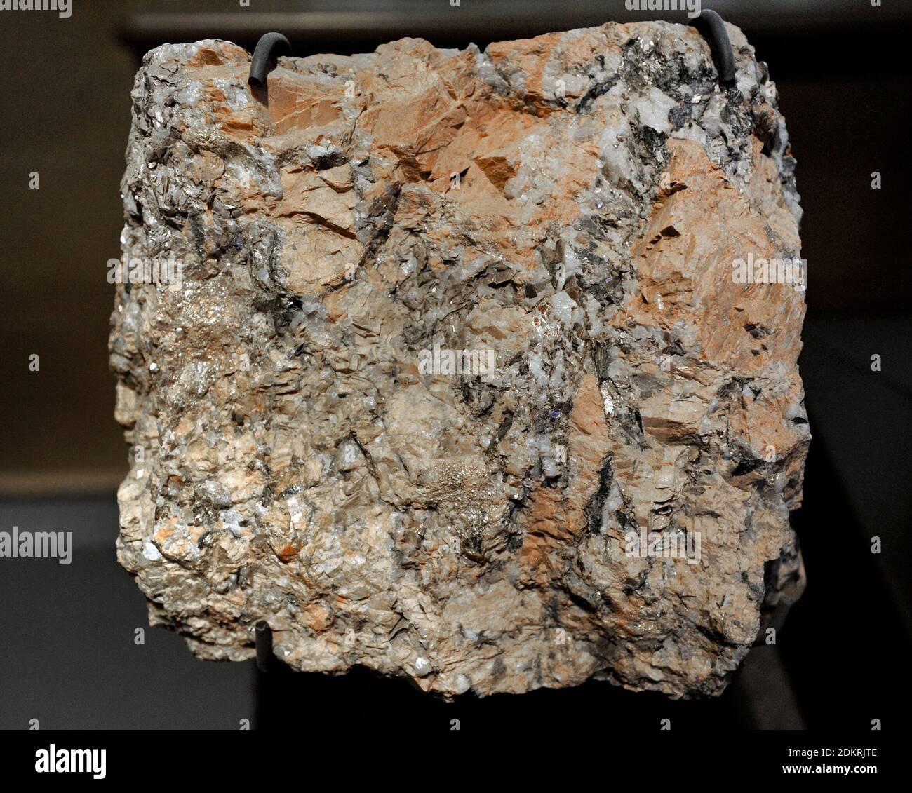 Pegmatite. Igneous rock, formed underground, with interlocking crystals usually larger than 2.5 cm in size. Most pegmatites are found in sheets of rock near large masses of igneous rocks called batholiths. From Germany. Natural History Museum, Berlin, Germany. Stock Photo