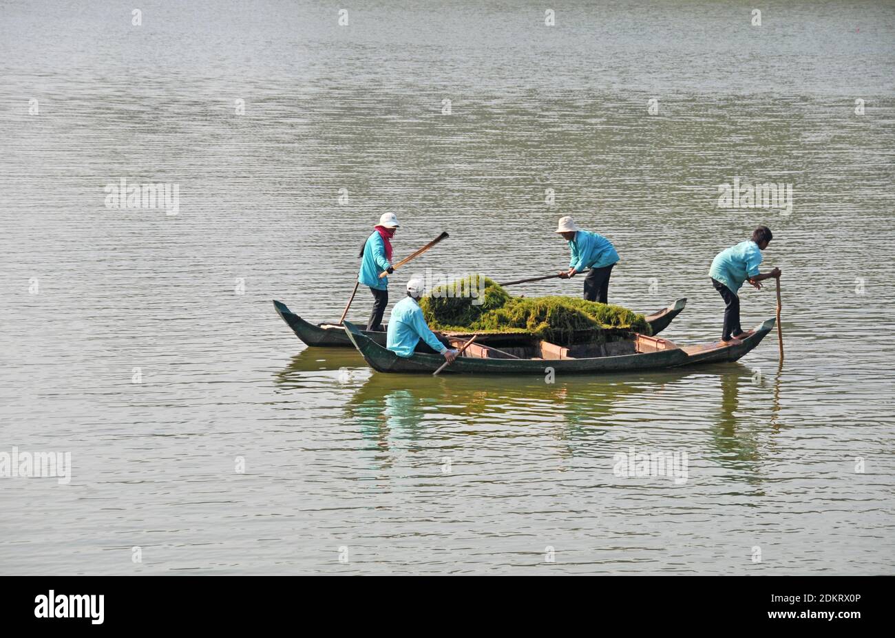 people working on a boat, Angkor Vat, Siem Reap, Cambodia Stock Photo