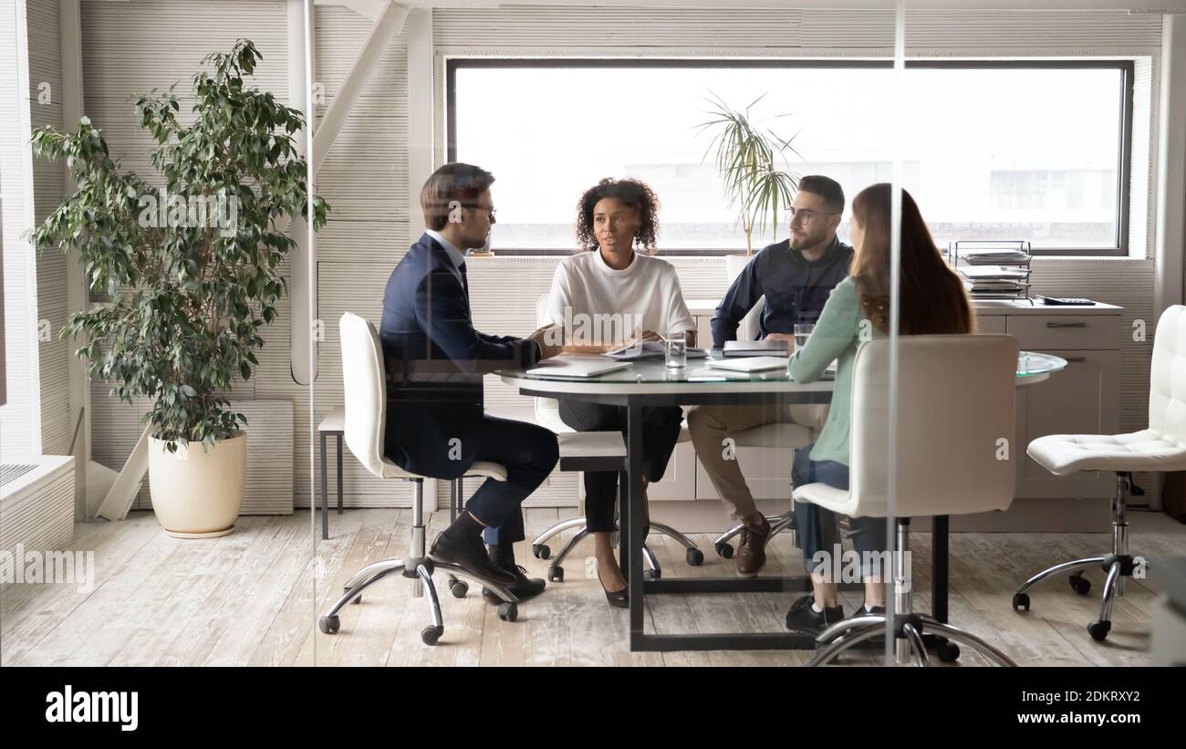 Diverse colleagues brainstorm at office team meeting Stock Photo - Alamy