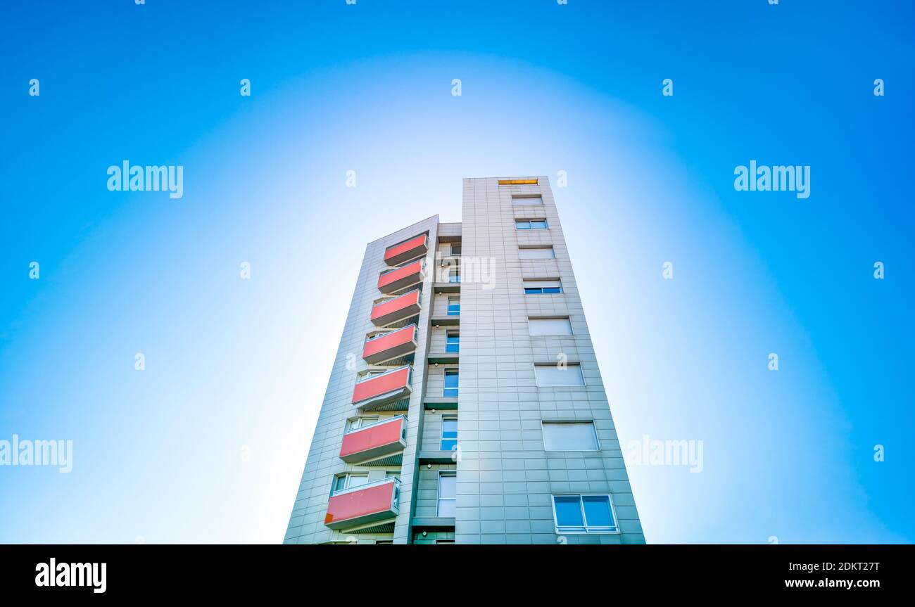 Residential building under blue sky with white circle Stock Photo