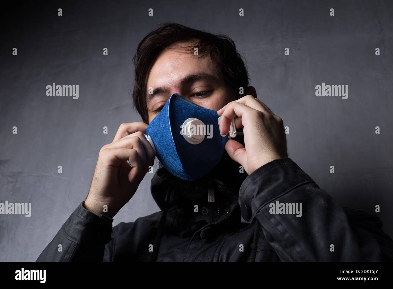 Man Wearing Pollution Mask Stock Photo