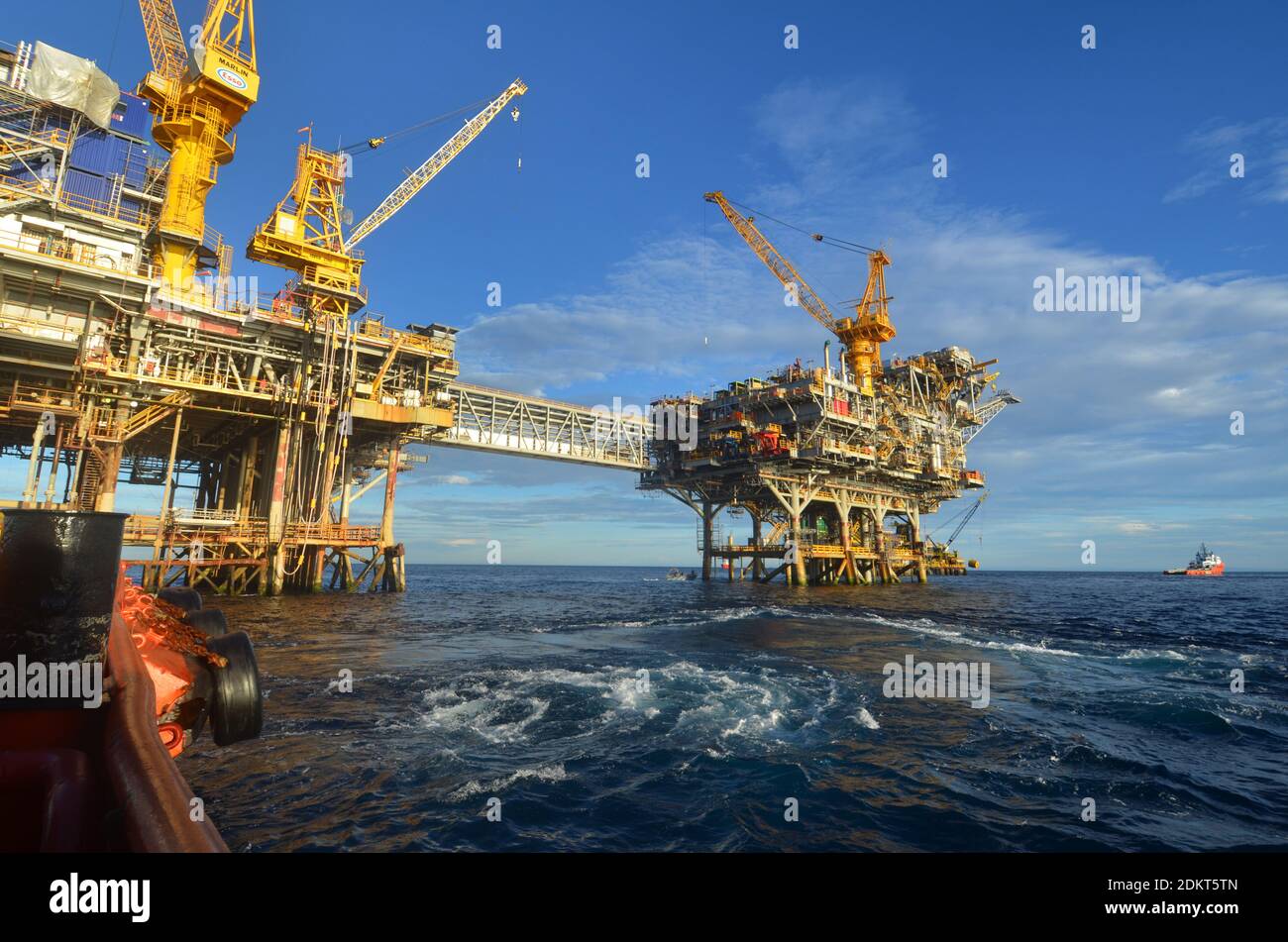 Marlin A and B platforms viewed from a workboat in Bass Strait Victoria Australia. The Oil and gas production rigs were joined by a crossover bridge. Stock Photo